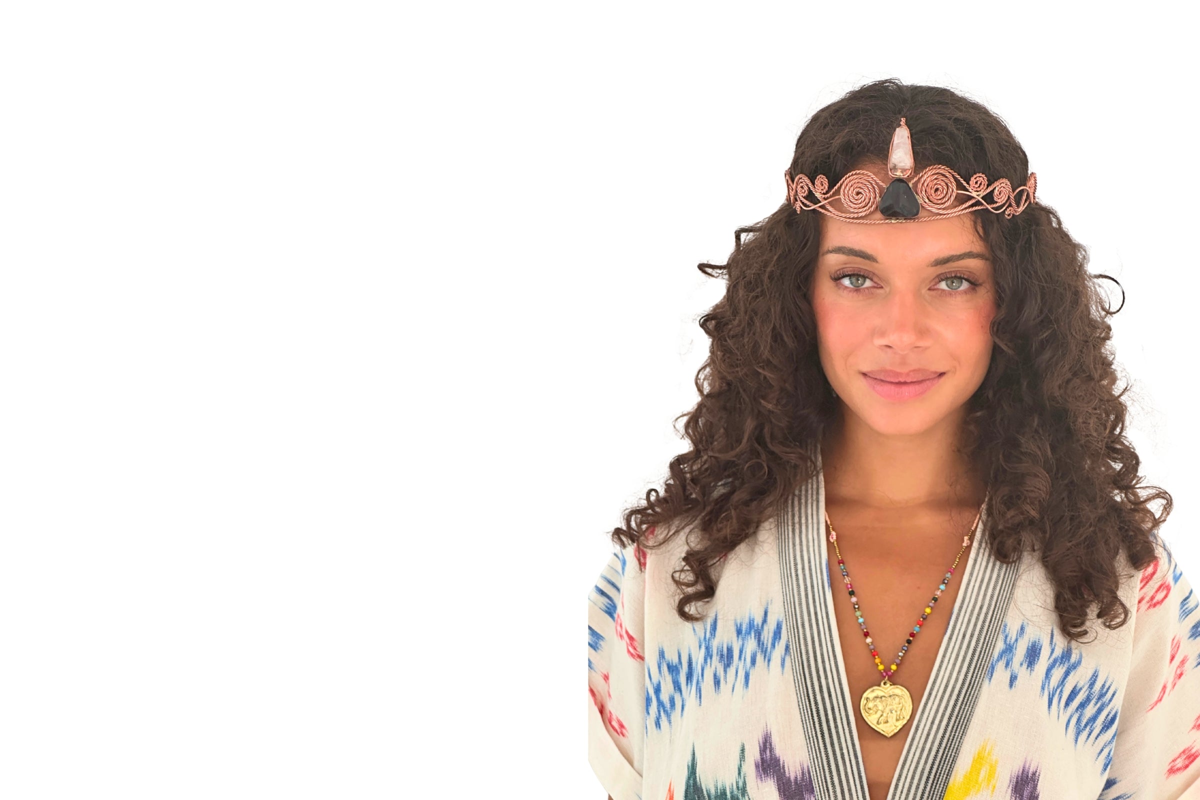 beautiful woman wearing indigenous feather and find robe and a handcrafted copper crystal headpiece 
